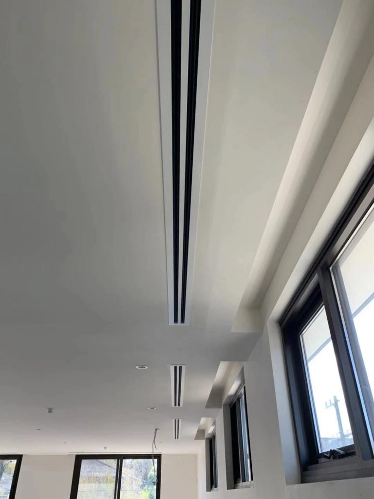 Concealed ducted air conditioning with a flush linear slot diffuser in a designer Melbourne home