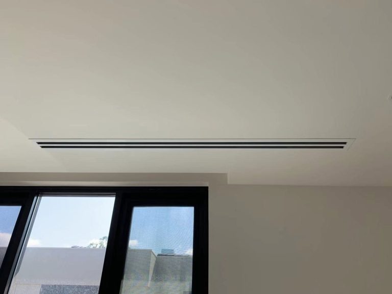 Concealed ducted air conditioning with a flush linear slot diffuser in a designer Melbourne home