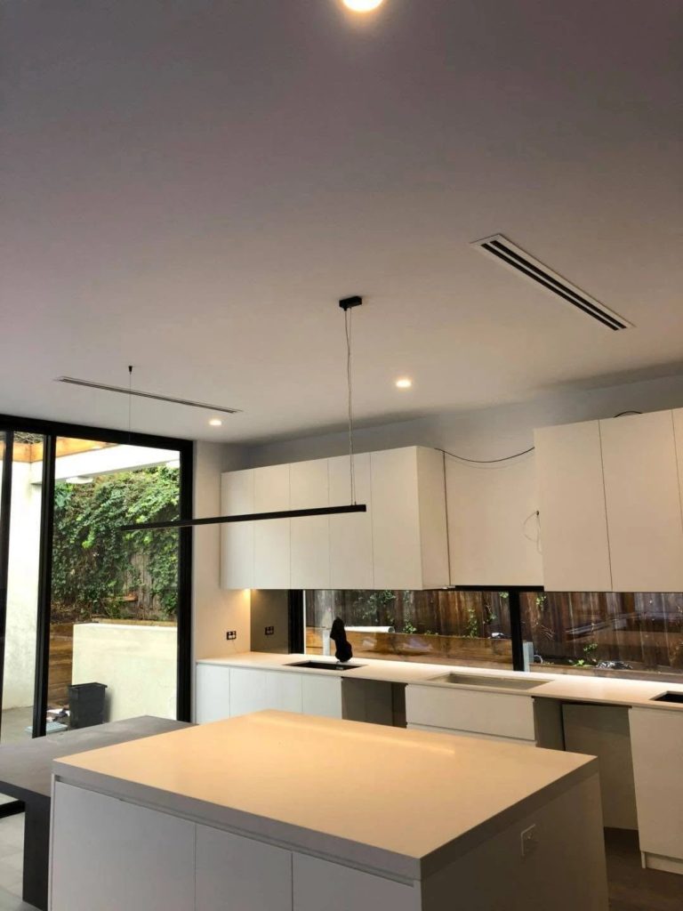 Concealed ducted air conditioning with a flush linear slot diffuser in a designer Melbourne home